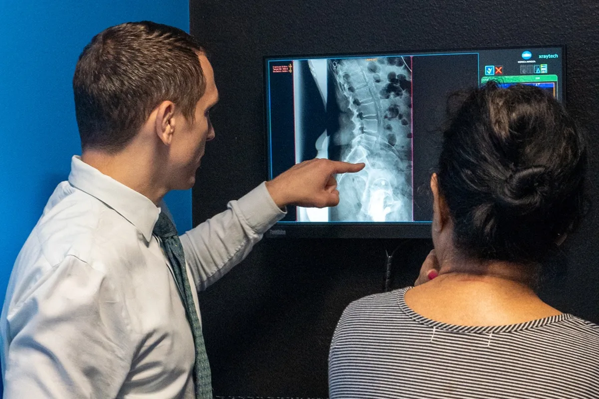 Chiropractor consultation spinal x ray back pain treatment at Stonelake Chiropractic in Austin